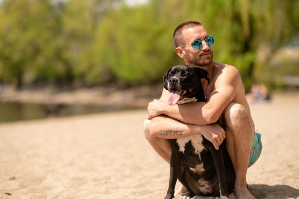 Photo of man and his dog at Kelowna beach 