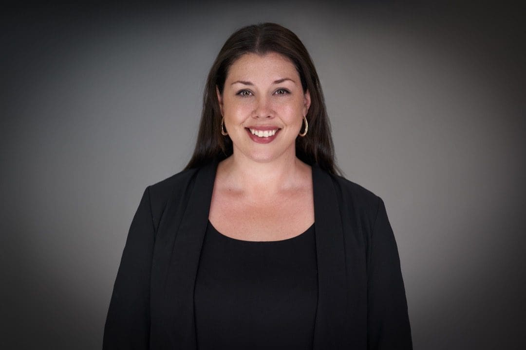 Woman having headshots taken in-studio